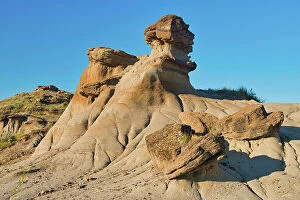 Images Dated 14th June 2023: Hoodoo with fallen caps, Badlands, UNESCO World Heritage Site, Dinosaur Provincial Park, Alberta