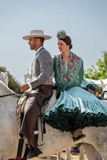 Rocio Prints: Horseman with woman traditionally dressed on horseback