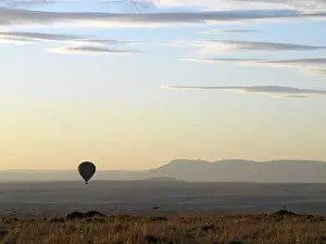 Float Prints: A hot air balloon floating over the Masai Mara Game Reserve at daybreak