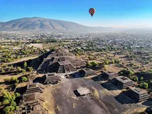 Balloon Prints: Hot air balloon flying over the Avenue of the Dead and the Pyramid of the Moon at sunrise