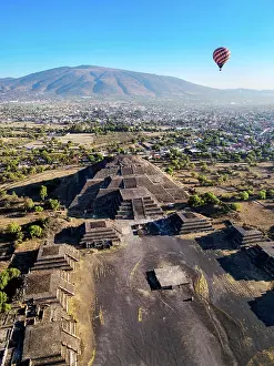 Balloon Prints: Hot air balloon flying over the Avenue of the Dead and the Pyramid of the Moon at sunrise