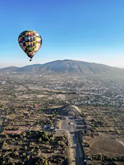 Balloon Prints: Hot air balloon flying over the Avenue of the Dead and the Pyramid of the Moon at sunrise