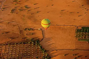 Hot Air Balloon Prints: Hot air balloon over the Moroccan landscape, Marrakech, Morocco