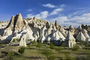 Images Dated 10th July 2008: Hot Air balloon over rock Tufa formaions (Fairy Chimneys), Love Valley, nr Goreme