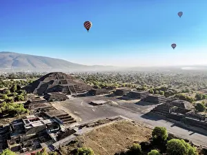 Balloon Prints: Hot air balloons flying over the Avenue of the Dead and the Pyramid of the Moon at sunrise