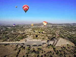 Balloon Prints: Hot air balloons flying over the Avenue of the Dead and the Pyramid of the Moon at sunrise