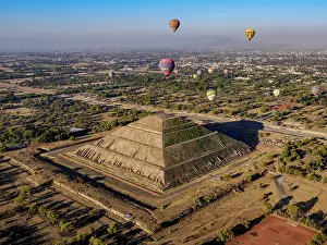 Balloon Prints: Hot air balloons flying over the Pyramid of the Sun and Avenue of the Dead at sunrise