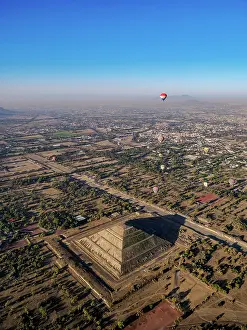 Balloon Prints: Hot air balloons flying over the Pyramid of the Sun and Avenue of the Dead at sunrise