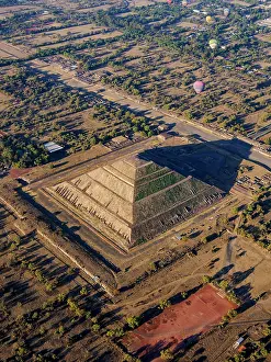 Balloon Prints: Hot air balloons flying over the Pyramid of the Sun and Avenue of the Dead at sunrise