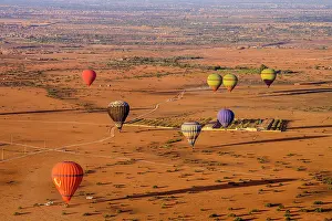 Balloons Prints: Hot air balloons over the Moroccan landscape, Marrakech, Morocco