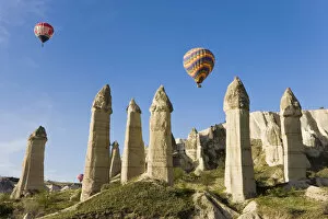Images Dated 10th July 2008: Hot Air Balloons over the Phallic pillars (Fairy Chimneys), Love Valley, near Goreme