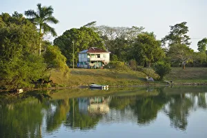 House on the banks of the Belize River, Burrel Boom Village, Belize City, Central America House on the banks of the Belize River, Burrel Boom Village, Belize City, Central America