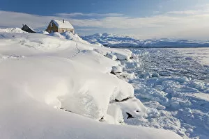 House on edge of fjord, Tiniteqilaq, Greenland