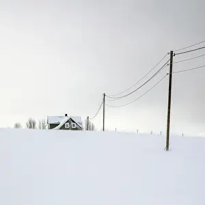 Troms Prints: House and telegraph poles in the snow, Senja, Norway