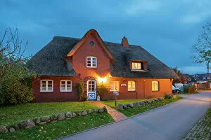Dwellings Gallery: House with traditional thatched roof at twilight, Nebel, Amrum island, Nordfriesland