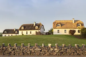 Houses near the Dunguaire Castle. County Galway, Connacht province, Ireland Houses near the Dunguaire Castle. County Galway, Connacht province, Ireland