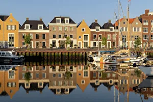 Old Port Prints: Houses along the old port reflected in the calm water, Harlingen, Friesland, Netherlands