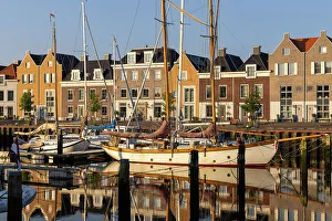 Old Port Prints: Houses along the old port reflected in the calm water, Harlingen, Friesland, Netherlands