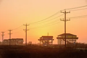 Protective Prints: Houses on pillars along the Gulf of Mexico coast, Bolivar Penninsula, Texas, USA