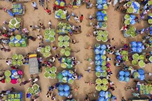 Huge baskets of mangoes are assembled one of the largest markets at Kansat