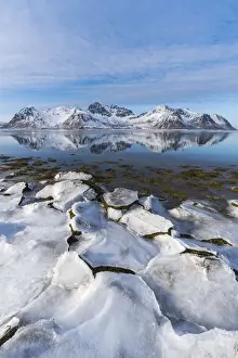 Nordland County Prints: Ice on the beach with Limstrandtinden snowcapped group in the background