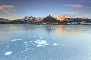 Madesimo Prints: Ice bubbles on the frozen surface of Andossi Lake at sunrise Spluga Valley Valtellina