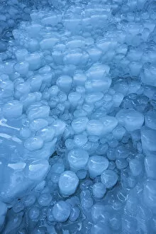 Ice formations below frozen waterfall, Julian Alps, Slovenia