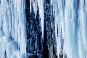 Basalt Prints: Ice stalactites close to Svartifoss waterfall in the Skaftafell National Park, Iceland