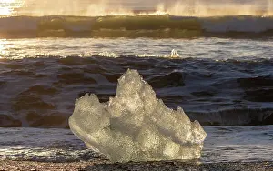 Iceberg Prints: Iceberg on the beach at sunrise, near Jokulsarlon glacial lagoon, Iceland