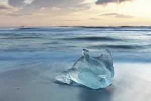 Iceberg Prints: Iceberg on the beach at sunrise, near Jokulsarlon glacial lagoon, Iceland