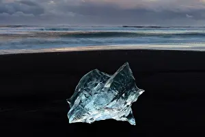 Icelandic Prints: Iceberg on black sand beach, near Jokulsarlon glacial lagoon, Iceland