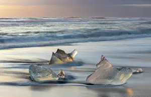 Icebergs Prints: Icebergs on the beach at sunrise, near Jokulsarlon glacial lagoon, Iceland