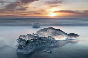 Wave Prints: Icebergs on the beach at sunrise, near Jokulsarlon glacial lagoon, Iceland