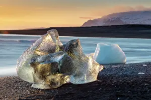 Icebergs Prints: Icebergs on the beach at sunset, near Jokulsarlon glacial lagoon, Iceland