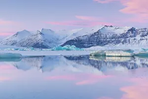 Snow Covered Prints: Icebergs on Jokulsarlon glacier lagoon at sunset