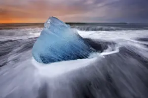 Icebergs stranded on the Breidamerkursandur beach at sunrise in the Vatnajokull