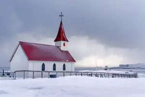 Nordic Prints: Iceland: the little church of Reynisfjara looking at the storm on the seashore