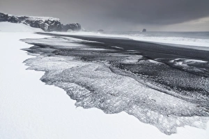 Iceland, South Iceland, Dyrholaey, Snowy beach of Dyrholaey