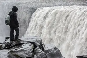 Power Prints: Iceland, a tourist admiring the power of Dettifoss waterfall