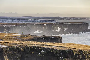 Snaefellsness Prints: Iceland, western Iceland, Snaefellsness peninsula, a man standing on the cliff