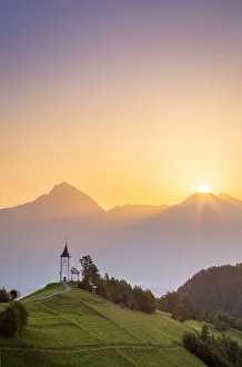 The iconic Jamik church, with Mount Triglav on the background