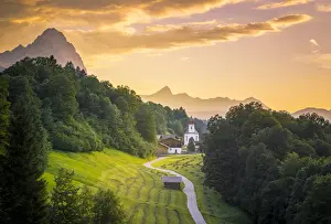 The iconic Wamberg Church, with Mount Alpspitze and Zugspitze on the background. Wamberg