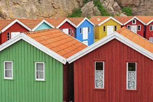 Rural Scene Prints: Idyllic and colorful fishing huts near the water