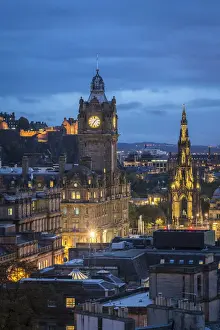 Illuminated Balmoral Hotel clock tower and Scott Monument seen from Observatory House