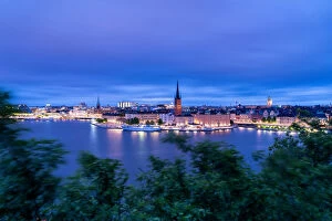 Baltic Collection: Illuminated buildings of Gamla Stan at dusk from Monteliusvagen