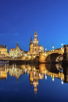 Saxony Prints: Illuminated Dresden Cathedral near Augustus Bridge over Elbe River at twilight