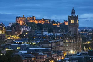 Illuminated Edinburgh Castle and Balmoral Hotel clock tower viewed from Observatory