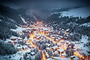 Chalet Prints: Illuminated fairy tale village of Madesimo covered with snow at Christmas