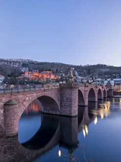 Heidelberg Prints: Illuminated Heidelberg castle and Alte Brucke (Old Bridge) in winter at night