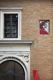 An illustration of Dante Alighieri on the wall of the "